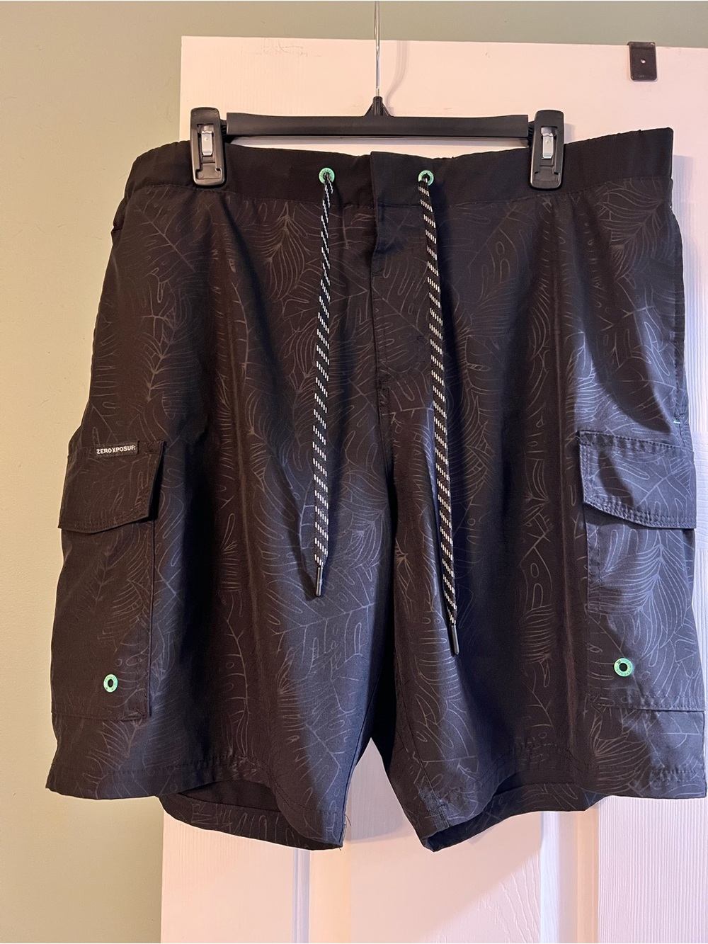 ZeroXposur Black Men's Swim Trunks with Green Eyelet Accents